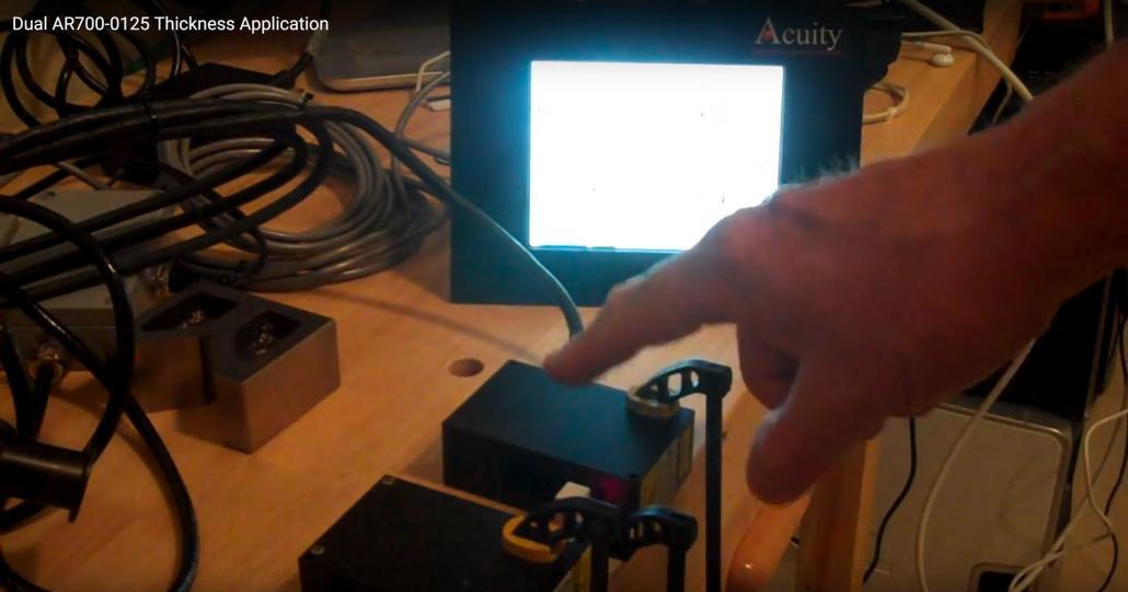 Sub-Micron Thickness Measurement with Dual Laser Sensors